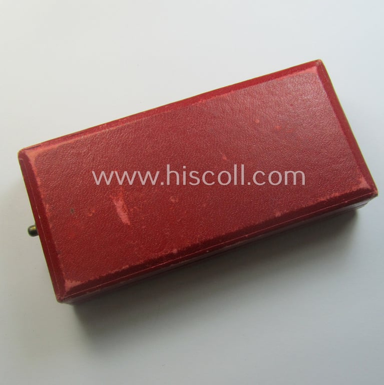 'Treuedienst Ehrenzeichen 1. Klasse' being a (typical) non-maker-marked example that came mounted onto its original ribbon (ie. 'Bandabschnitt') and that comes stored in its etui as issued