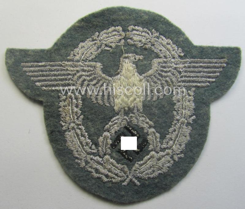 Police- (ie. 'Polizei'-) related armbadge (ie. arm-eagle) being a typical machine-embroidered example