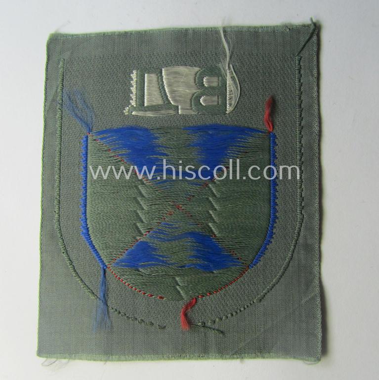 Eastern- ie. Russian volunteer (ie. Cossack-) related armshield as executed in the neat 'BeVo'-weave pattern depicting the interwoven 'Cyrillic' characters: 'BA' (as was intended for the Russian volunteers serving within the 'Don Cossacks')