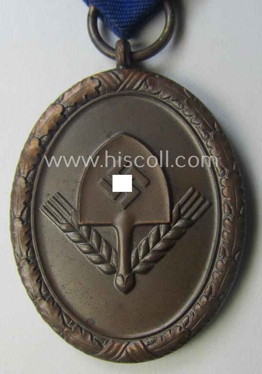 RAD (ie. 'Reichsarbeitsdienst'): 'Dienstauszeichnung 4. Stufe für Männer' as was intended for 4 years loyal-service and that comes mounted onto its period (broad-sized) ribbon (ie. 'Bandabschnitt')