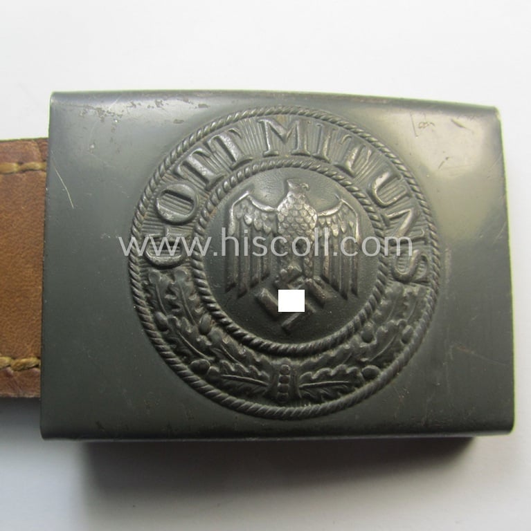 WH (Heeres) 'standard-pattern', field-grey-toned- and steel-based belt-buckle being a maker- (ie. 'H. Arld - Nuernberg'-) marked- and/or: '1941'-dated example that comes mounted onto its leather-based tab