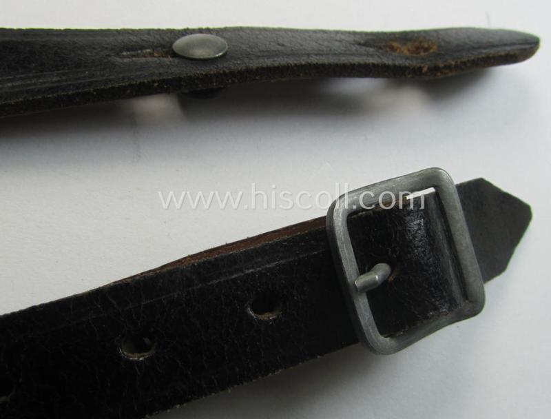 Early-war-period- and 'standard-issue'-pattern, black-coloured- and/or leather-based WH helmet-strap (ie. 'Riemen für Stahlhelm') being an: 'BMD 41'-marked example that comes in a never mounted ie. 'virtually mint' condition