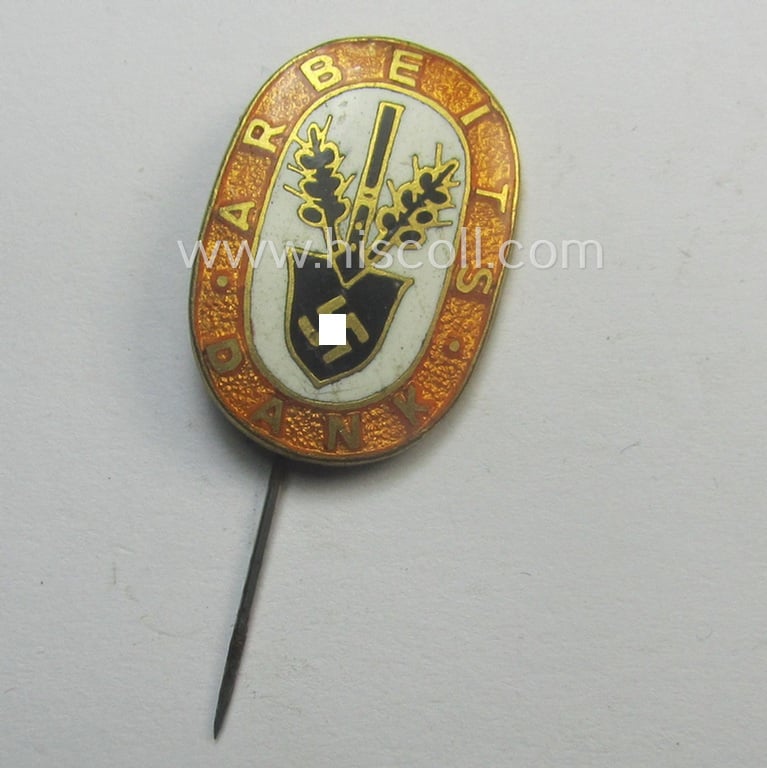 Bright orange-coloured and neatly enamelled 'Reichsarbeitsdienst'- (ie. RAD-) related lapel-pin (ie. 'Ehrennadel') entitled: 'Arbeitsdank' (that shows a 'Ges.Gesch.'-patent-pending-marking on its back)