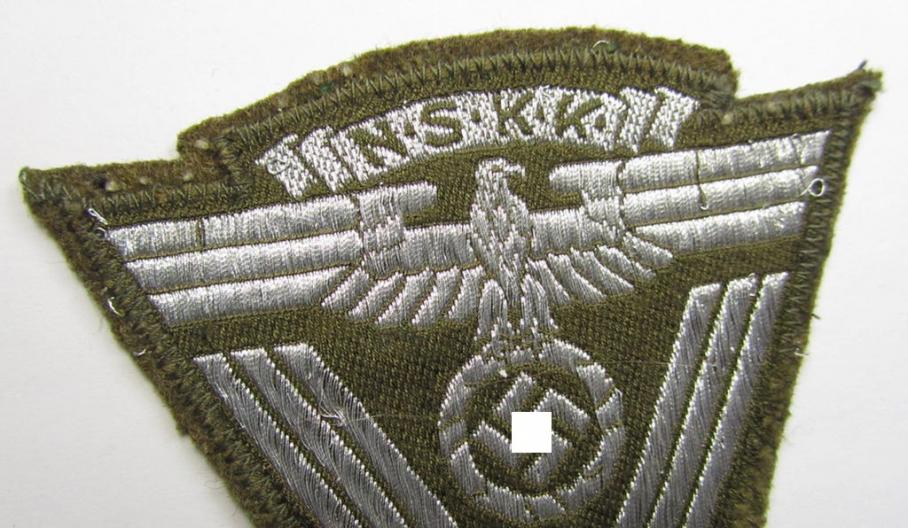 Unusally seen - and actually scarcely encountered! - N.S.K.K. (ie. 'National Socialistisches Kraftfahr Korps') so-called: 'N.S.K.K.-Ärmelabzeichen' showing a combined arm-eagle and/or chevron and period-attached 'RzM-etiket'