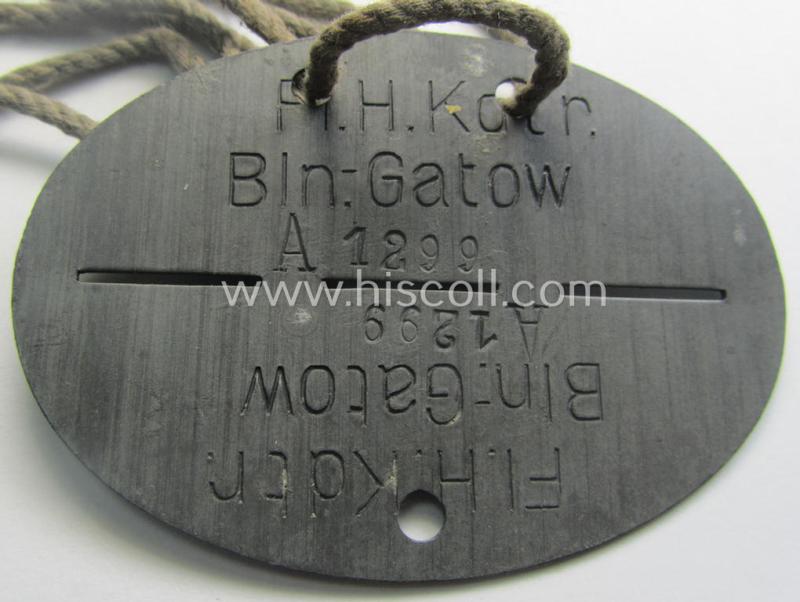 Zinc-based, WH (LW) ie. 'Flieger o. Geschwader'-related ID-disc bearing the clearly stamped unit-designation that simply reads: 'Fl.H.Kdtr. Bln.-Gatow' (and as such belonging to a staff-member serving at the famous airfield: 'Berlin-Gatow')