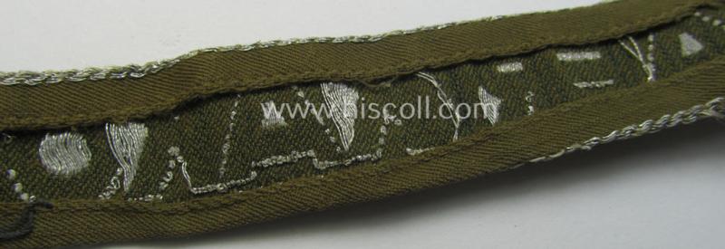 Truly worn, 'BeVo'-like cuff-title (ie. 'Ärmelstreifen') entitled: 'Afrikakorps' being a with certainty issued example that comes in an overall nice- (ie. somewhat shortened- and/or once tunic-attached-), condition