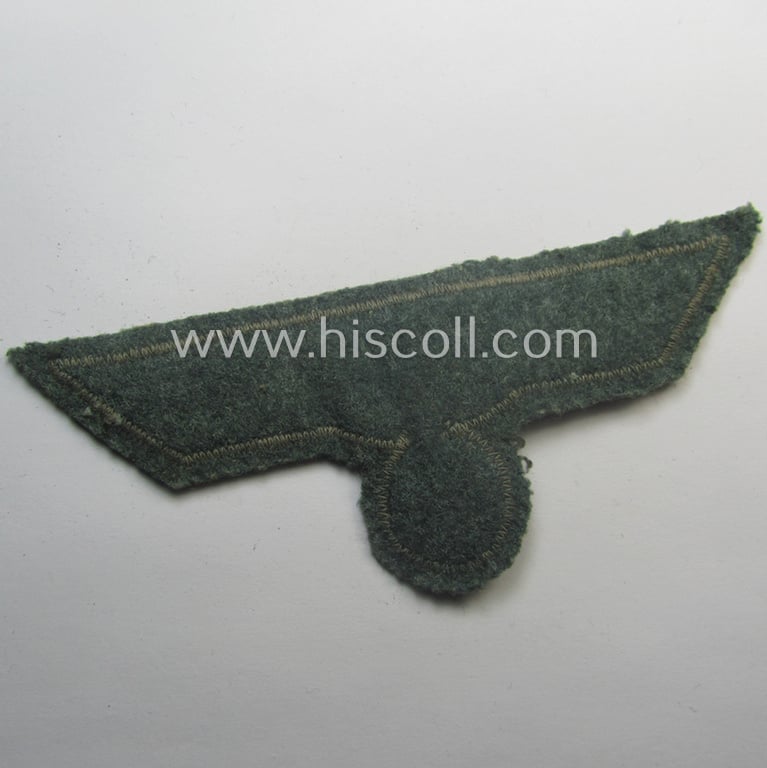 WH (Heeres) breast-eagle as executed in 'BeVo'-type-, so-called: 'flat-wire'-weave-pattern and pre-mounted on field-grey-coloured wool as was specifically intended for usage by soldiers (ie. NCOs) on their dress-tunics (ie. 'Waffenröcke')