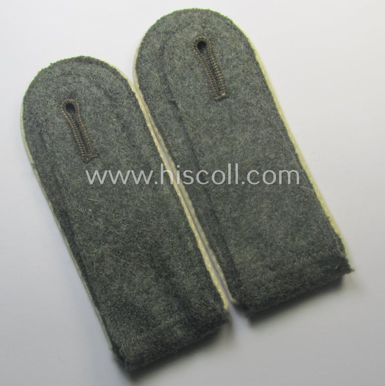 Pair of WH (Heeres), early- (ie. mid-) war-period- (ie. 'M41- o. M43'-) pattern EM-type shoulderstraps as piped in the white-coloured branchcolour as was intended for a: 'Soldat eines Infanterie-Rgts.'