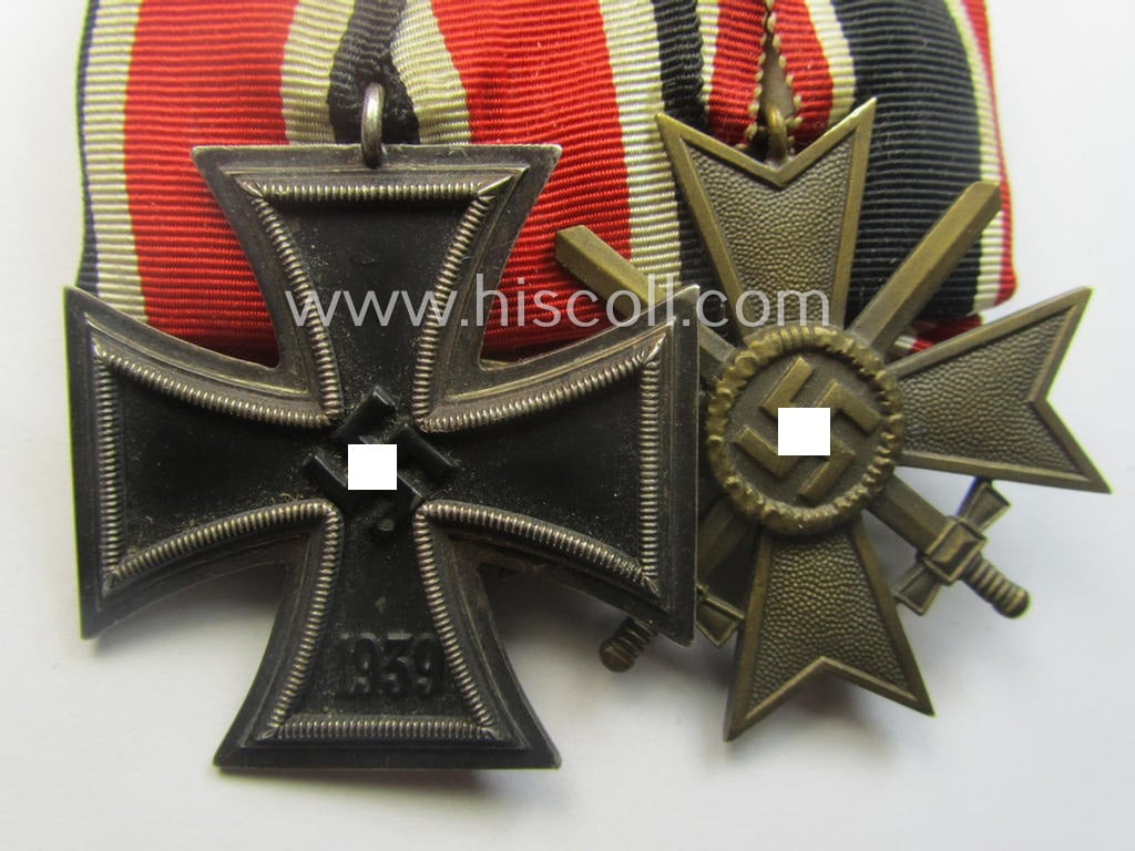 Two-pieced medal-bar (ie. 'Orden- o. Doppelspange') showing resp. an: 'Eisernes Kreuz II. Kl.' and a: 'Kriegsverdienstkreuz II. Klasse mit Schwn.' that both come period-mounted as a: 'Doppelspange'