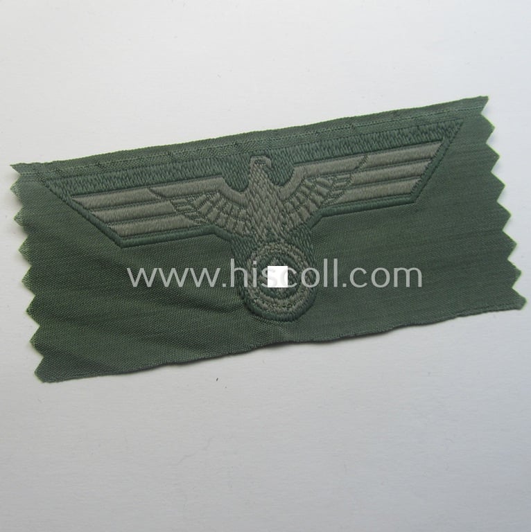Early- (ie. mid-) war-period, WH (Heeres) cap-eagle & cocarde-set (ie. 'Schiffchenmützen-Adler u. Kokarde-Satz für Mannschaften u. Uffz.') being a 'virtually mint' set as executed in bluish-grey-coloured linnen on a field-grey-coloured background