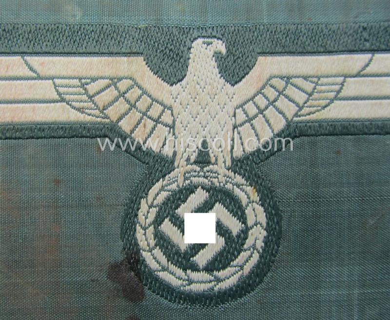WH (Heeres) early- (ie. pre-war-) period- and/or greyish-coloured breast-eagle of the: 'M36'- (ie. 'M40'-) pattern as was executed in the 'BeVo'-weave pattern on a darker-green-coloured background