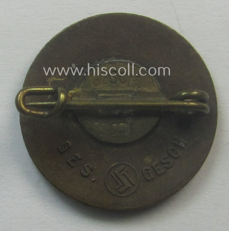 Unusually seen - smaller-sized- and darker-red-coloured! - 'N.S.D.A.P.'-membership-pin- ie. party-badge (or: 'Parteiabzeichen') being a maker- (ie. 'S&L'-) marked example that shows a (dual): 'Ges.Gesch.'-patent-pending-designation
