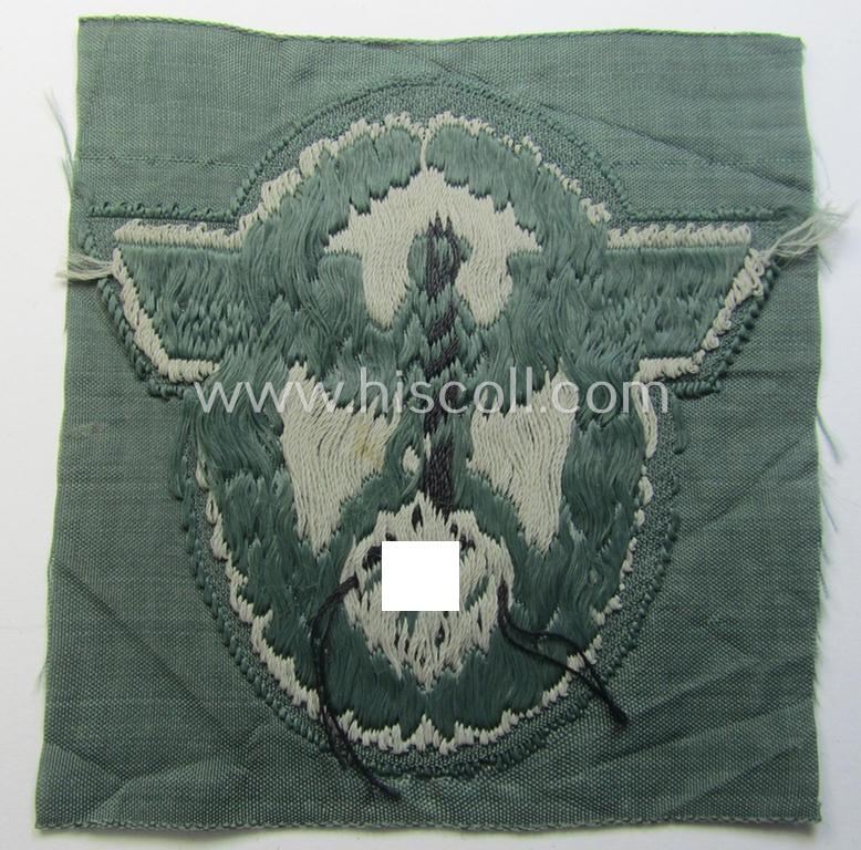 Police- (ie. 'Polizei'-) related armbadge (ie. arm-eagle) being a typical 'BeVo'-woven example