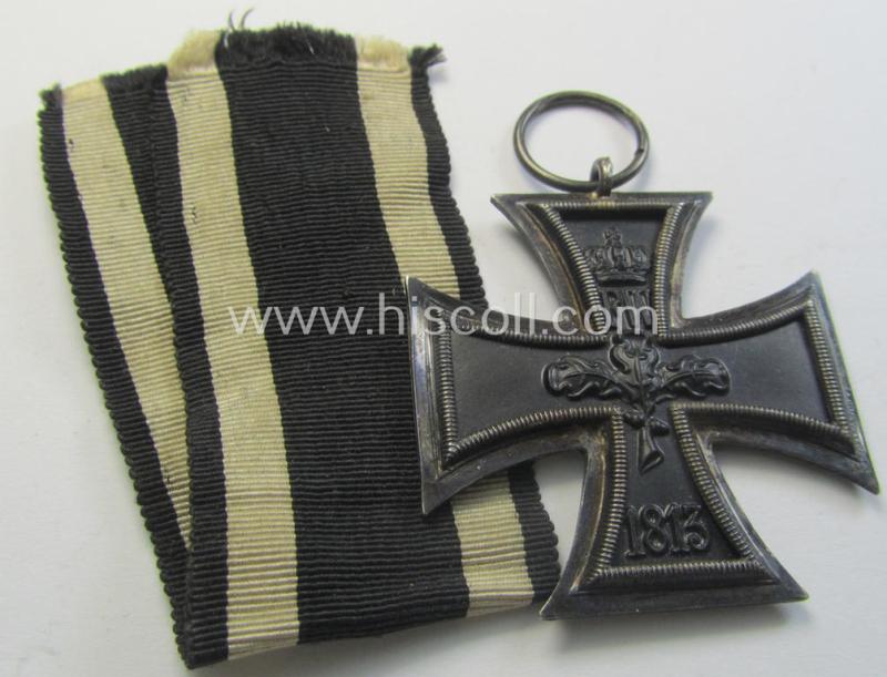 Attractive, WWI-period: 'Eisernes Kreuz II. Klasse' (or: iron cross second class) being a typical maker-marked example that comes together with its (minimally) confectioned but long-sized piece of ribbon (ie. 'Bandabschnitt')