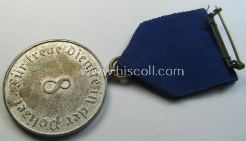 Bright-silver-toned so-called: 'Polizei-Dienstauszeichnung 3. Stufe' (or: police loyal-service medal 3rd class) that comes mounted onto its period ribbon (ie. 'Bandabschnitt')