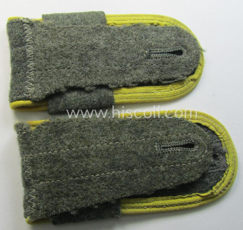 Pair of later-war-period, WH (Heeres) so-called: 'M44'-styled ie. 'simplified', EM-type shoulderstraps having a pair of 'A'-'Überschuben' attached as intended for a: 'Soldat eines Nachr.-Rgts. o. Abts.'