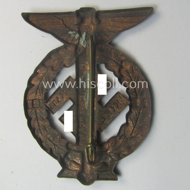 Commemorative, reddish-copper-coloured- and/or tin-based, N.S.D.A.P.- (ie. SA-) related 'tinnie' being a non-maker-marked example depicting an upward-positioned sword, swastika and text that reads: 'Nordmark Voran - Kiel - 25.26.5.1935'