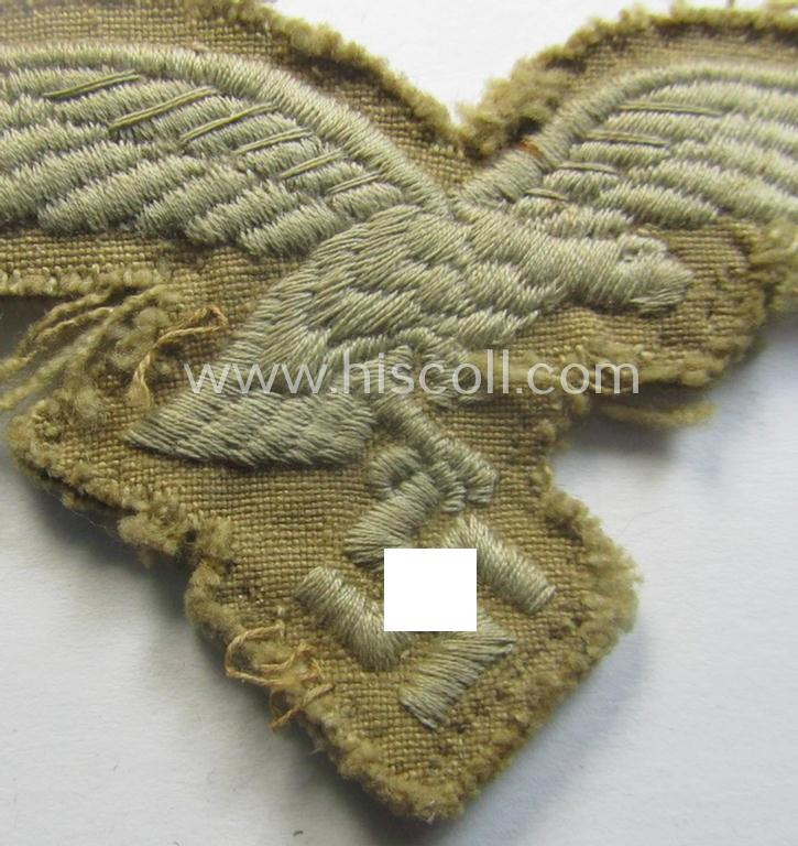 Clearly used - and actually very scarcely found! - WH (Luftwaffe) 'tropical'-issued- (ie. DAK or 'Deutsches Afrika Korps'-related) EM- ie. NCO-type breasteagle as was specifically intended for usage on the tropical-tunics