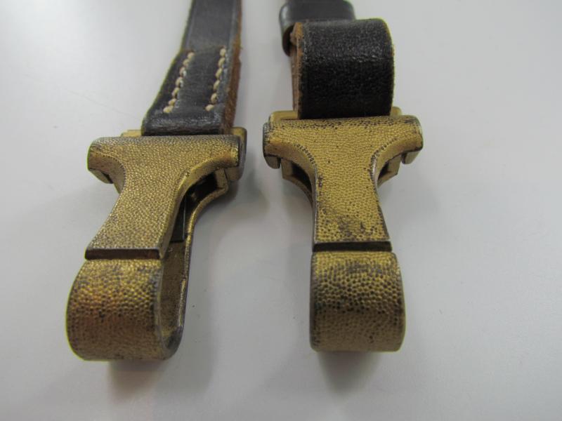 Leather shoulder strap marked DRGM