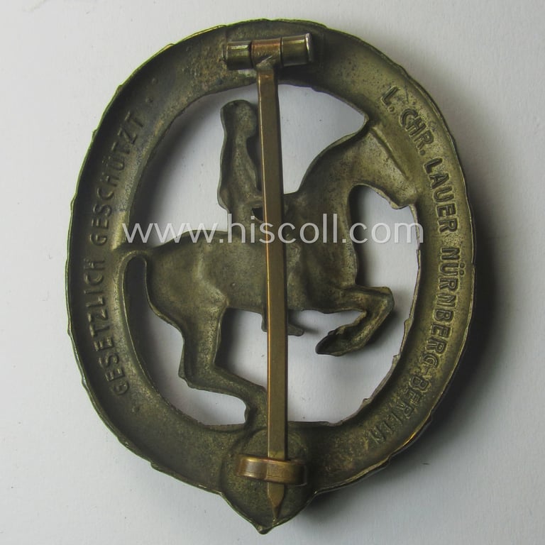 'Deutsches Reiterabzeichen der 3. Klasse (ie. 'in Bronze') being a maker- (ie. 'L.Chr. Lauer'-) marked example