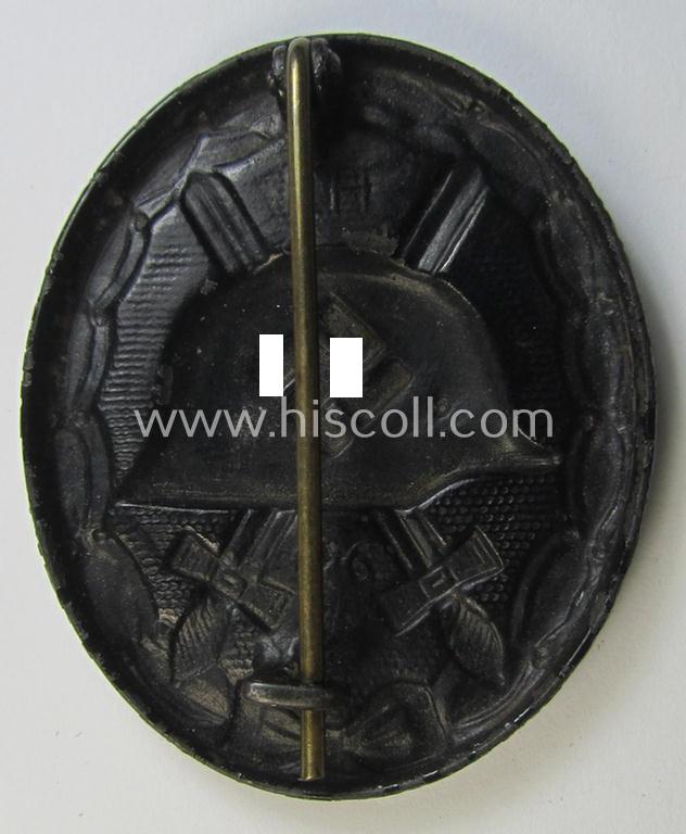 Neat, dual-maker- (ie. 'E.H.'- and/or: '126'-) marked example of a black-class wound-badge (or: 'Verwundeten-Abzeichen in Schwarz') being an example that was produced by the maker (ie. 'Hersteller') named: 'Eduard Hahn'