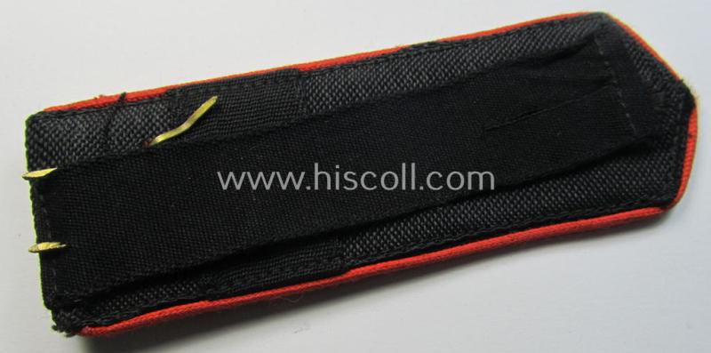 Moderately worn - albeit regrettably single! - bright-red-piped so-called: 'Allgemeine-HJ'-shoulderstrap as intended for an: 'HJ-Scharführer' who served within the 'Bann 271' (271 = 'Bann Lüneburger Heide' situated in the 'Gebiet Nord Nordse...