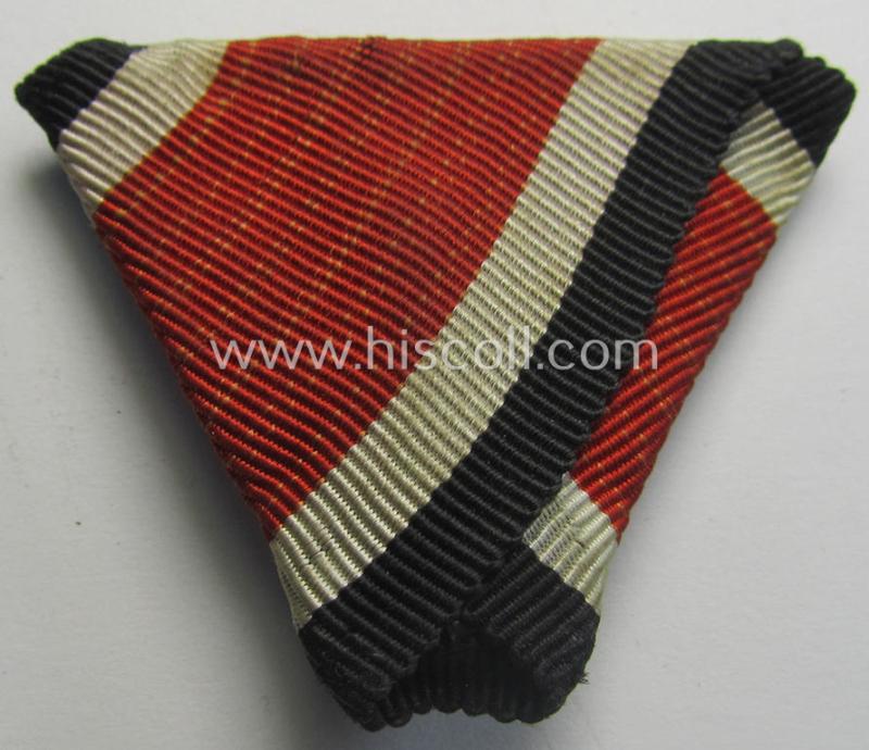 Neat, Iron Cross 2nd class (or: 'EK II. Klasse') being a non-maker-marked example that comes mounted onto its original (Austrian-styled!) ribbon (ie. 'Bandabschnitt') as was (I deem) produced by the (Austrian-based) company named: 'Rudolf Souval...