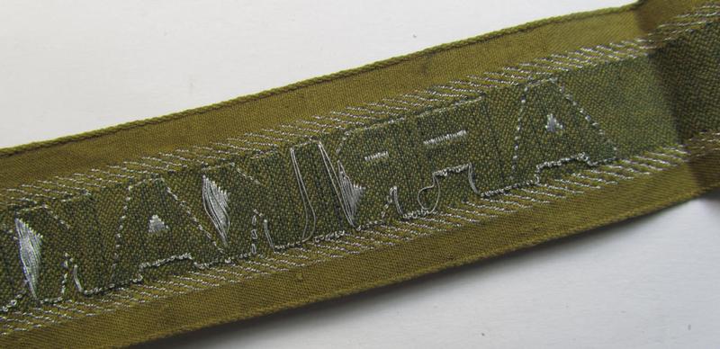 Superb, 'BeVo'-like cuff-title (ie. 'Ärmelstreifen') entitled: 'Afrikakorps' being a with certainty issued and truly worn example that comes in an overall nice- (ie. non-shortened- and most certainly once tunic-attached-), condition