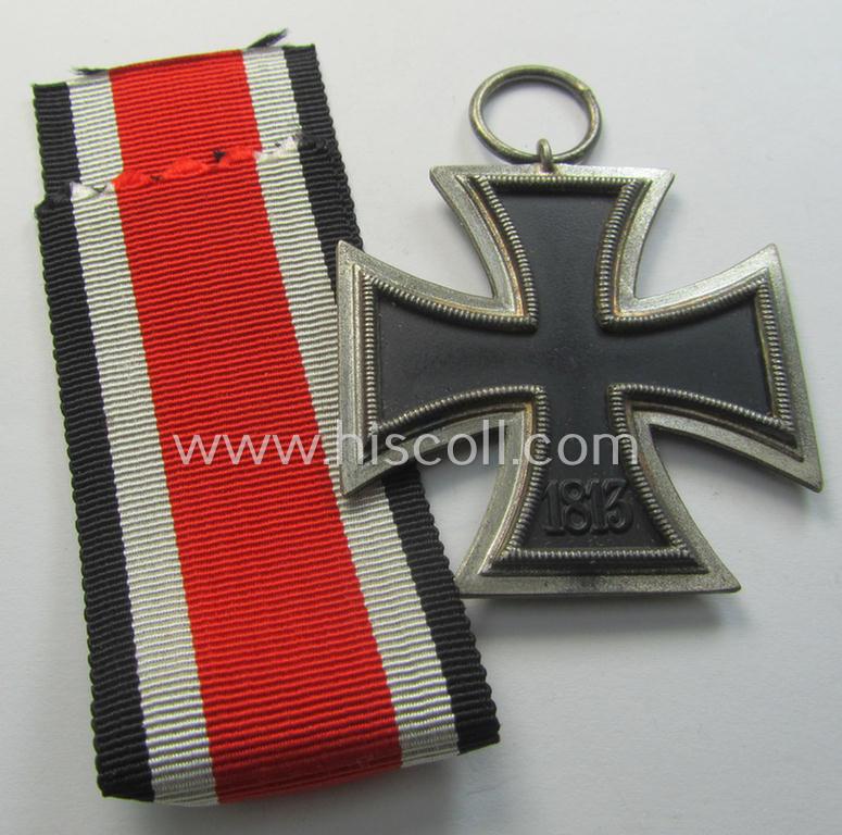 'Eisernes Kreuz II. Klasse' being a non-maker-marked example that comes together with its original- and once-mounted ribbon (ie. 'Bandabschnitt') as was produced by a (by me) unidentified maker (ie. 'Hersteller')