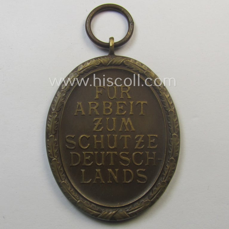 Medal-set: 'Deutsches Schutzwall Ehrenzeichen' (aka: 'Westwall'-medal) being a (typical) non-maker-marked- and/or: typical 'Buntmetall'-based specimen that comes packed in its original pouch of issue by the: 'Wilh. Hobacher'-company