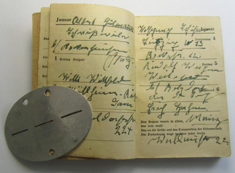 Interesting, aluminium-based WH (Heeres) ie. 'mot. Artillerie'-related ID-disc bearing the clearly stamped unit-designation: '11.Batt.S.Mot.A.R. 263' and that comes together with its 1945-dated agenda (ie. 'Kalender') as stored for decades