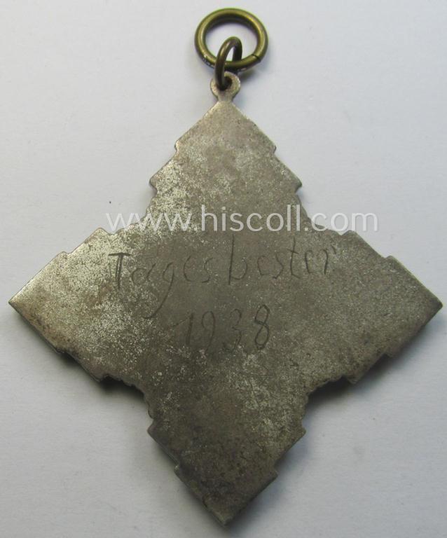 Most certainly unusually found, silver-toned (and neatly enamelled!) commemorative shooting-contest-medal that shows the period-engraved text: 'Tagesbester 1938'