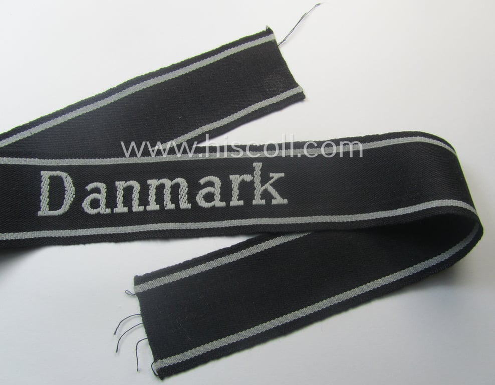 Stunning, Waffen-SS 1944-pattern cuff-title (ie. 'Ärmelstreifen') as executed in typical semi-'BeVo'-weave-pattern as was intended for members within the: 'SS-Panzer-Gren.-Rgt. 24' “Danmark” (part of the 11. SS-Frw.-Pz.-Gren.-Division “Nordland”)