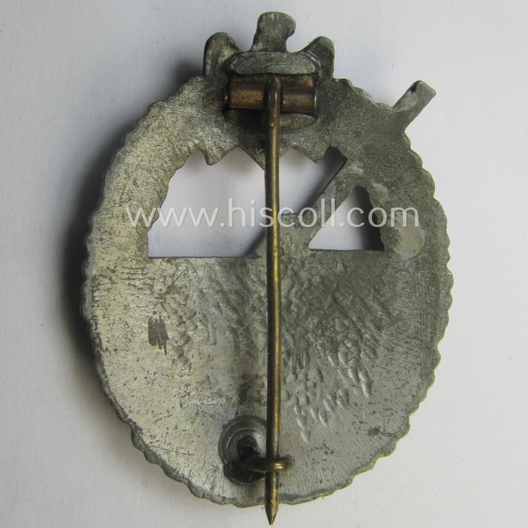 WH (KM) 'Marine-Artillerie-Abzeichen' being a maker- (ie. 'H.A.'-) marked- and/or typical zinc- (ie. 'Feinzink'-) based example by the: 'Hermann Aurich'-company