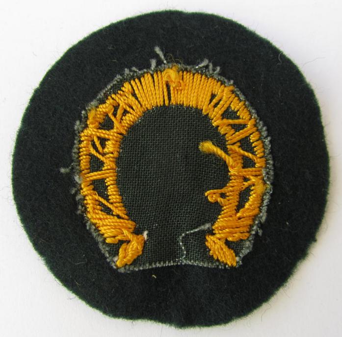 Nice, WH (Heeres) so-called trade- and/or special career arm-patch as intended for a: 'Hufbeschlagmeister' (or farrier), being a nicely hand-embroidered variant on darker-green-coloured wool - overall nice condition!