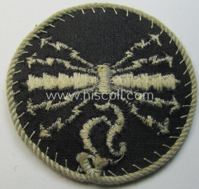 Attractive - albeit moderately used! - example of a WH (Luftwaffe) machine-embroidered, trade- ie. special-career-patch (ie. 'Tätigkeitsabzeichen') having a silver-white-toned 'Kordel' attached as was intended for: 'LW-Horchfunker'-staffmembers