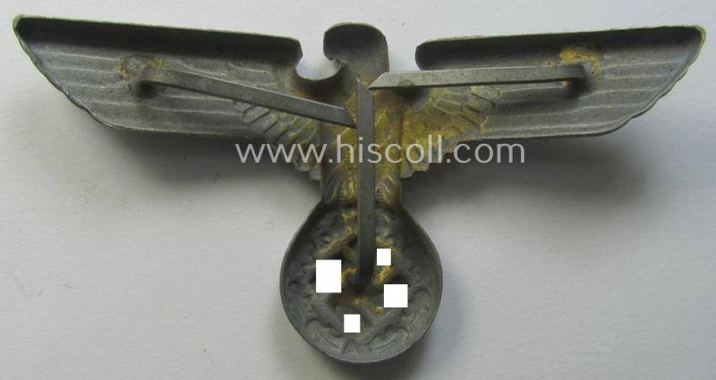 Greyish-silver-coloured- (ie. faded gold) and/or: zinc- (ie. 'Feinzink'-) based (political-style) visor- (ie. 'Schirmmützen'-) cap-eagle being a detailed example that is totally void of a makers'-designation