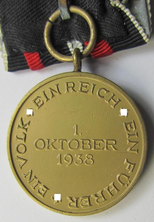Neat, bright golden-toned WH (Heeres o. KM etc.) so-called: 'Einzelspange' (being of the 'standard-issued'- ie. 'detachable'-pattern) showing a WH Czech 'Anschluss'- (ie. occupation-) medal: '1 October 1938'
