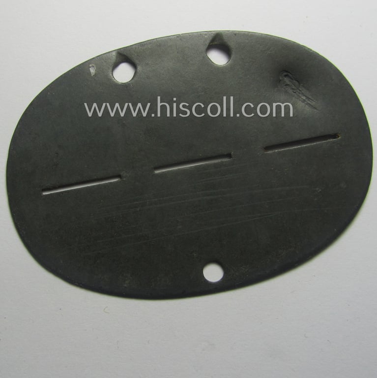 Zinc-based, WH (Heeres) ie. 'Nachrichten'-related ID-disc (ie. 'Erkennungsmarke') bearing the stamped unit-designation that reads: '3./N.E.A. 14' and that comes as issued- and/or worn