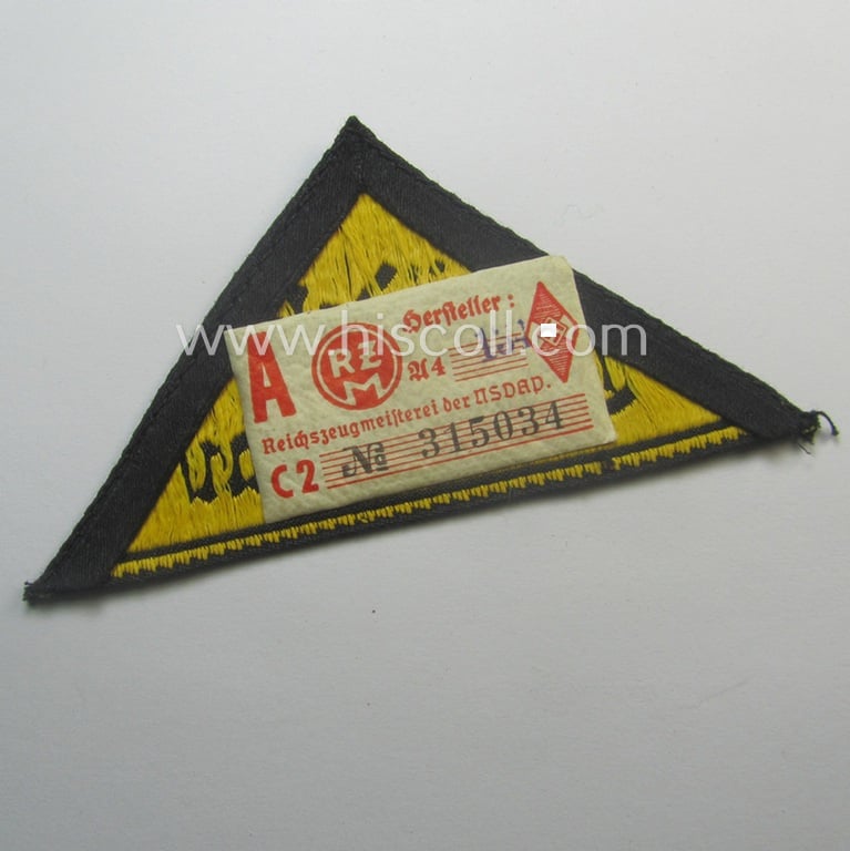 'HJ' ('Hitlerjugend') district-triangle (ie. 'Gebietsdreieck') entitled: 'Südost Oberdonau' (being a 'virtually mint' example that retains its period-attached, paper-based so-called: 'RzM'-etiket)