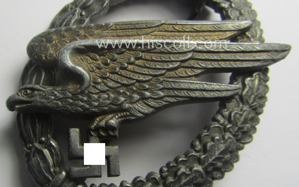 WH (Luftwaffe) 'Fallschirmschützen-Abzeichen' (or: paratroopers-jumpbadge) being a maker- (ie. 'B&N - L'-) marked- and typical zinc- (ie. 'Feinzink'-) based example by: 'Berg u. Nolte'