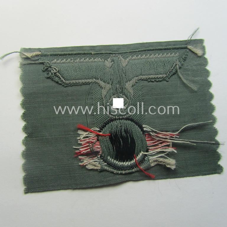 WH (Heeres) 'T-shaped' M42-model cap-eagle/cocarde as executed in 'BeVo'-weave pattern (being an attractive example that comes in a never used- nor cap-attached, condition)