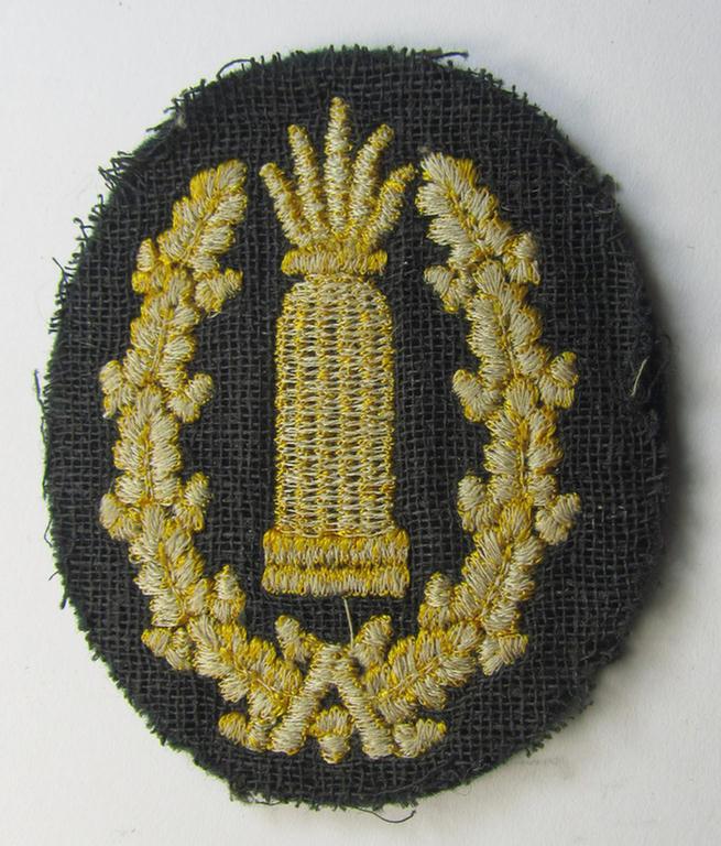 Neat - moderately used- and/or worn! - example of a WH (Heeres) 'Richtabzeichen für Artillerie-Richtkannoniere' (or: artillery gun-layers patch) as executed in the machine-embroidered-pattern (and that comes in a carefully tunic-removed condition)