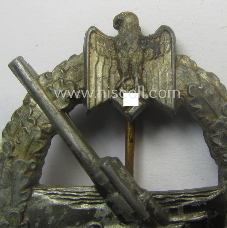 WH (KM) 'Marine-Artillerie-Abzeichen' being a maker- (ie. 'H.A.'-) marked- and/or typical zinc- (ie. 'Feinzink'-) based example by the: 'Hermann Aurich'-company