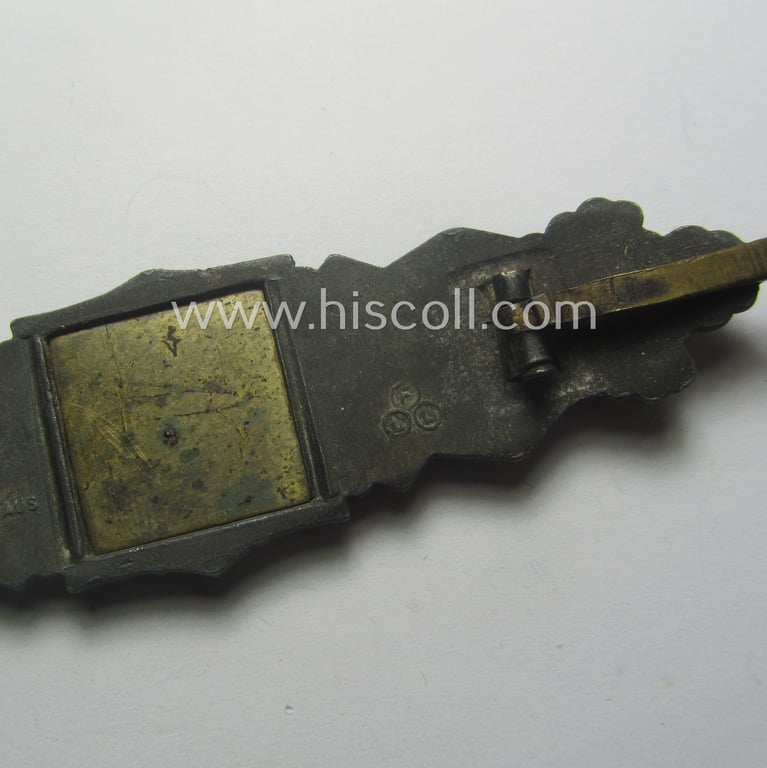 'Nahkampfspange in Bronze' (or: bronze-class close-combat clasp ie. CCC) being a (typical) maker-marked- and/or minimally converse-shaped specimen as was produced by the maker- (ie. 'Hersteller') 'Friedrich Linden' (ie. 'FLL')