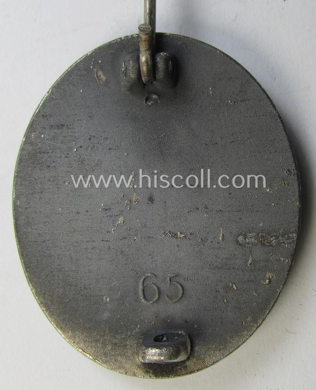 Attractive - and moderately used- and worn! - example of a maker- (ie. '65'-) marked example of a silver-class wound-badge (or: 'Verwundeten-Abzeichen in Silber') as was produced by the 'Hersteller' ie. maker: 'Klein u. Quenzer'