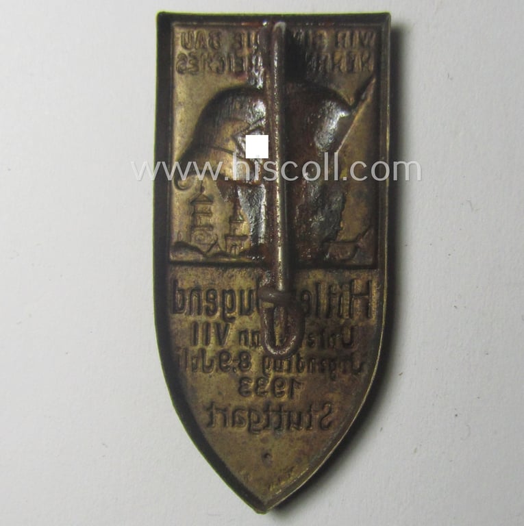 Attractive, commemorative 'HJ'- (ie. 'Hitlerjugend'-) related 'tinnie' being a non-maker-marked example depicting a flag with 'HJ-Raute' with below the text: 'Hitler-Jugend - Unterbann V.II - Jugendtag Stuttgart - 8.-9. Juni 1933'