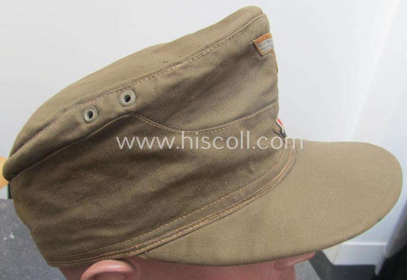 WH (Heeres), 'M41-pattern', tropical-issued field-cap (ie.: 'Tropen-Einheitsfeldmütze') being an (approx.) 57-cms.-sized example that is totally void of a makers'-, date- nor size-designation and that comes in a moderately worn- ie. used, condit...