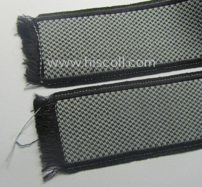 Waffen-SS, 1943/44 pattern cuff-title (ie. 'Ärmelstreifen') depicting the machine-woven Latin script text in silver-grey linnen as was intended for a member of the: '34. SS-Freiwilligen-Grenadier-Division': “Landstorm Nederland”