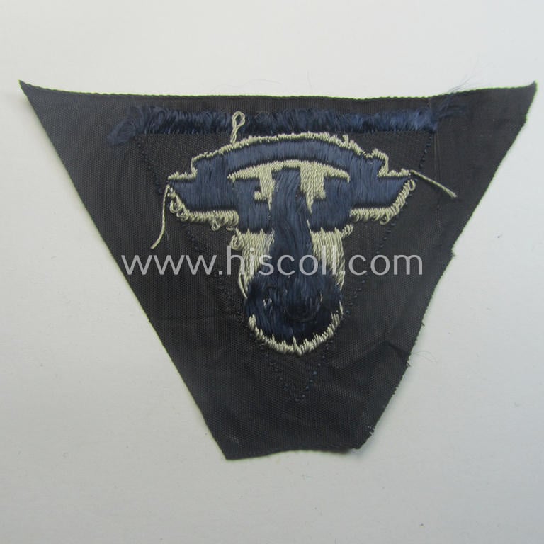 Never used - ie. 'virtually mint'! - so-called: N.S.K.K. (ie. 'National Soc. Kraftfahr Korps') side-cap-eagle (ie. 'Adler für Schiffchenmütze') being a 'BeVo'-woven example that comes mounted onto a darker-blue-coloured background